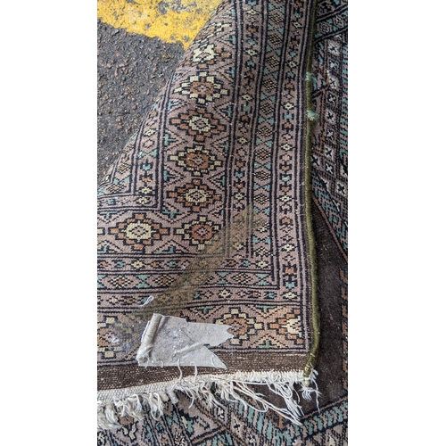 391 - Two hand woven rugs to include an Indian floral design rug, 160cm x 94.5cm, and a Pakistani rug havi... 