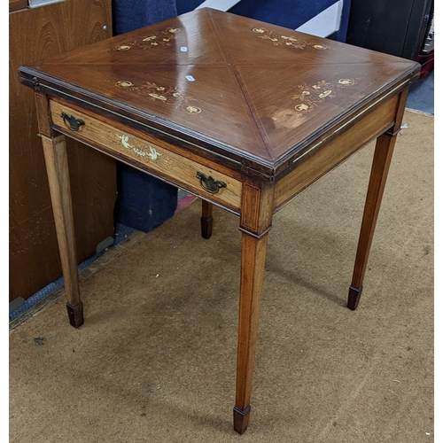 393 - A late Victorian rosewood marquetry inlaid envelope card table having an inset drawer and on square ... 