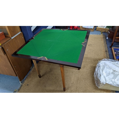 393 - A late Victorian rosewood marquetry inlaid envelope card table having an inset drawer and on square ... 