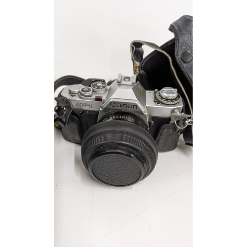 402 - A quantity of photographic equipment to include a Canon Av-1, A Nikon F90X, a  Pentax ME super and o... 