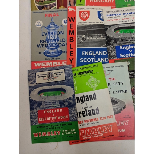 356 - Twenty one football programmes and souvenirs brochures from the 1950s, 60s and 70s to include matche... 