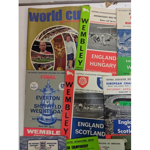 356 - Twenty one football programmes and souvenirs brochures from the 1950s, 60s and 70s to include matche... 