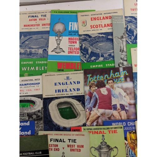 356 - Twenty one football programmes and souvenirs brochures from the 1950s, 60s and 70s to include matche... 