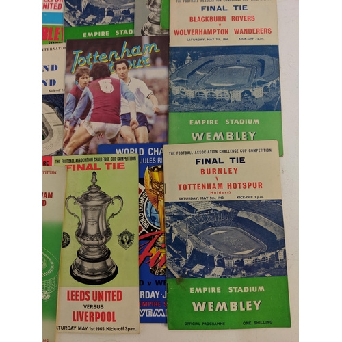 356 - Twenty one football programmes and souvenirs brochures from the 1950s, 60s and 70s to include matche... 