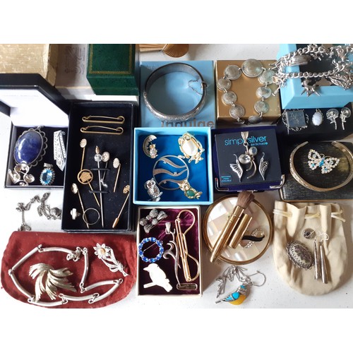 216 - A quantity of jewellery and collectables to include a white metal charm bracelet, a coin bracelet, a... 