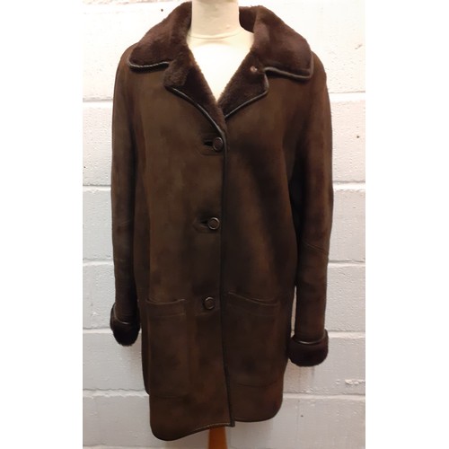 225 - A vintage French 'Creation Spung Freres' ladies brown sheepskin  coat having overturned cuffs, 2 fro... 