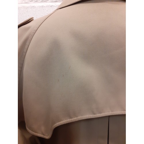 228 - A vintage Barstons camel coloured rain mac for Motsch & Fils, Paris having a double breasted front f... 