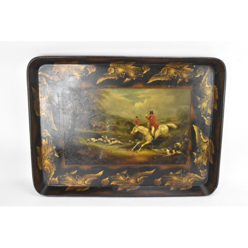 126 - A tray top table having a Victorian black lacquered papier mache tray with a floral border enclosing... 