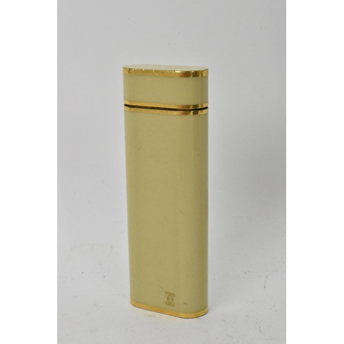 137 - A Cartier Briquet enamel and gold plated lighter, numbered 05601J to the base, 7cm