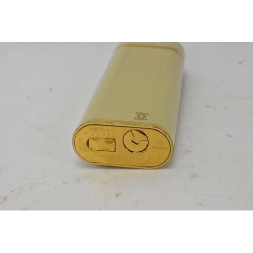 137 - A Cartier Briquet enamel and gold plated lighter, numbered 05601J to the base, 7cm