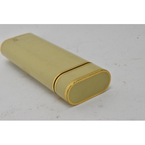 137 - A Cartier Briquet enamel and gold plated lighter, numbered 05601J to the base, 7cm