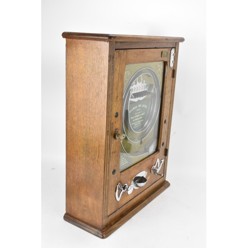 142 - An Allwin De Luxe oak cased penny slot machine, circa 1920, with internal metal ball track, central ... 