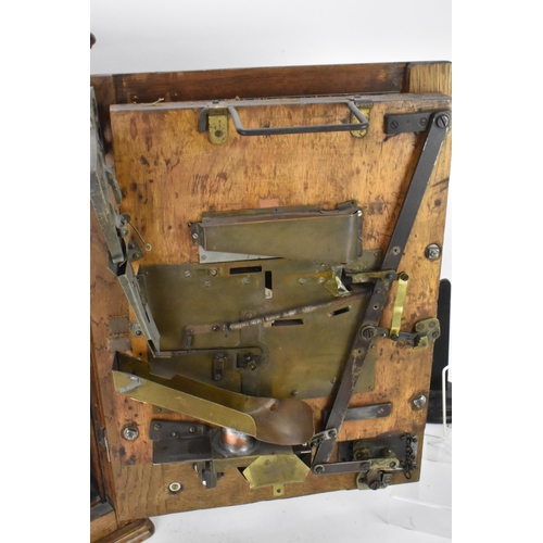 142 - An Allwin De Luxe oak cased penny slot machine, circa 1920, with internal metal ball track, central ... 