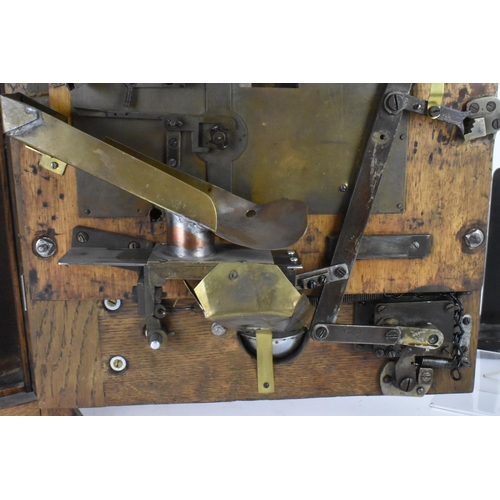 142 - An Allwin De Luxe oak cased penny slot machine, circa 1920, with internal metal ball track, central ... 