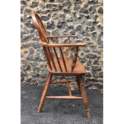 145 - A pair of 19th century elm and ash Windsor carver dining chairs, having spindle hoop shaped backs, t... 