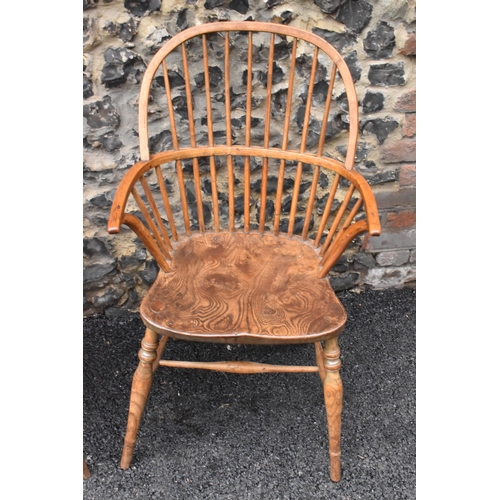 145 - A pair of 19th century elm and ash Windsor carver dining chairs, having spindle hoop shaped backs, t... 