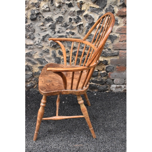 145 - A pair of 19th century elm and ash Windsor carver dining chairs, having spindle hoop shaped backs, t... 