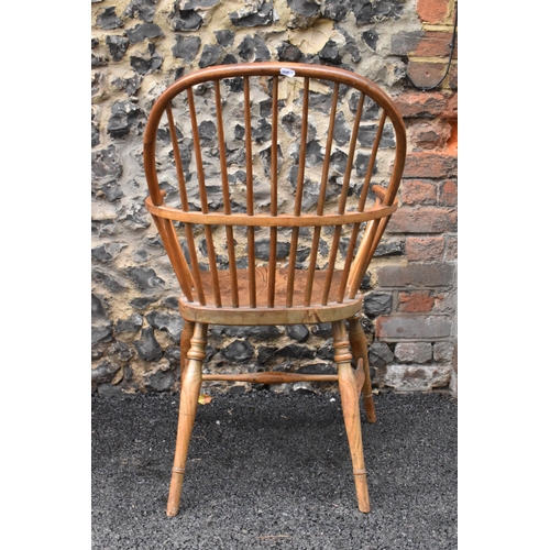 145 - A pair of 19th century elm and ash Windsor carver dining chairs, having spindle hoop shaped backs, t... 