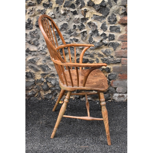 145 - A pair of 19th century elm and ash Windsor carver dining chairs, having spindle hoop shaped backs, t... 