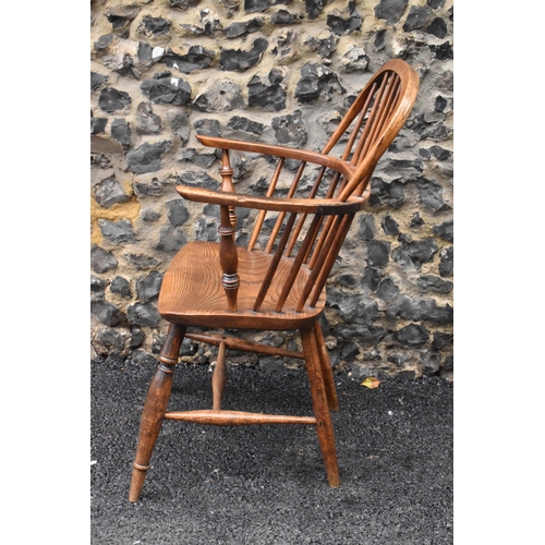 145 - A pair of 19th century elm and ash Windsor carver dining chairs, having spindle hoop shaped backs, t... 