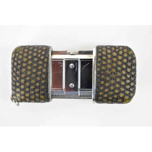 26 - A Movado Chronometre Ermeto Art Deco steel and snake skin travelling purse watch, having a square si... 