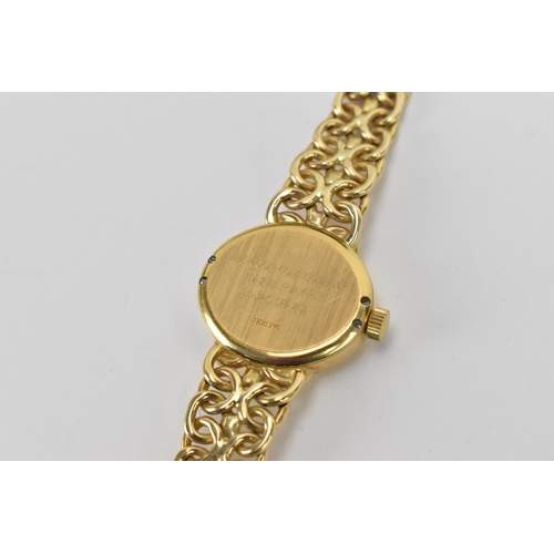 35 - A Rolex, manual wind, ladies, 14ct gold dress watch, circa 1993, having a oval silvered dial, baton ... 