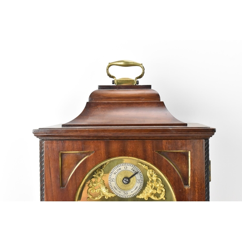 50 - A late 19th/early 20th century mahogany 8 day mantle clock, the case having an inverted bell top wit... 