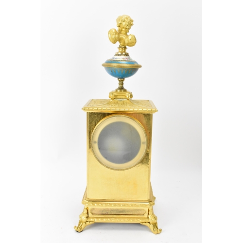 59 - A late 19th century French mantle clock, the gilt metal case cast with floral scoll decoration, wing... 