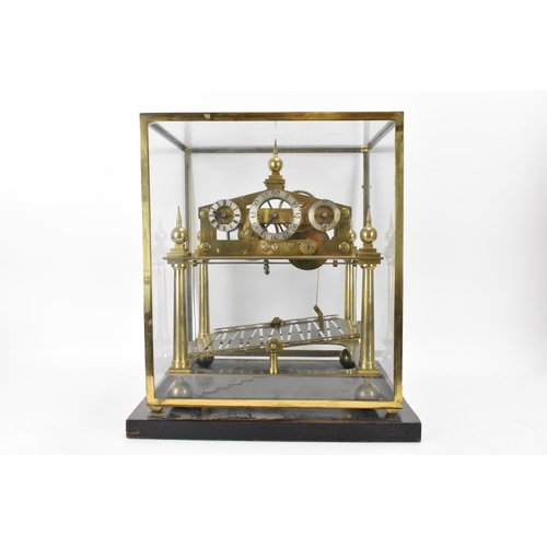 61 - A 20th century Congreve clock, housed in glass display cabinet, having three silvered chapter rings,... 