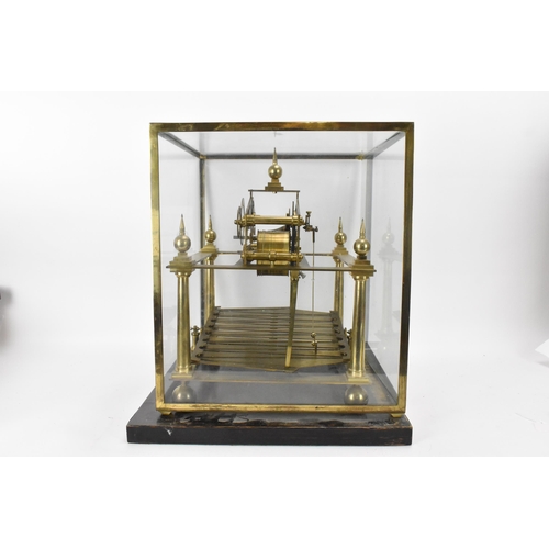 61 - A 20th century Congreve clock, housed in glass display cabinet, having three silvered chapter rings,... 