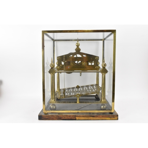 61 - A 20th century Congreve clock, housed in glass display cabinet, having three silvered chapter rings,... 