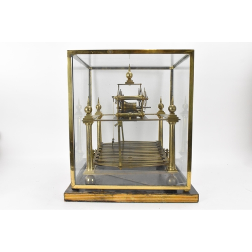 61 - A 20th century Congreve clock, housed in glass display cabinet, having three silvered chapter rings,... 