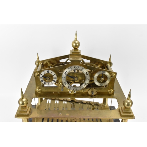 61 - A 20th century Congreve clock, housed in glass display cabinet, having three silvered chapter rings,... 