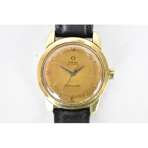 63 - An Omega Seamaster, automatic, gents, 18ct gold wristwatch, having a gilt dial, centre seconds, bato... 