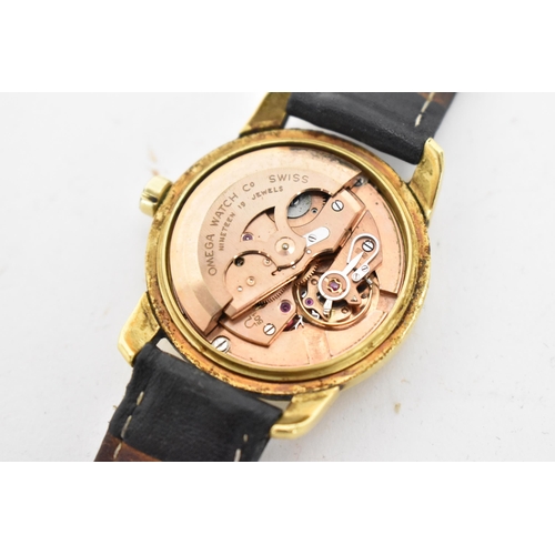 63 - An Omega Seamaster, automatic, gents, 18ct gold wristwatch, having a gilt dial, centre seconds, bato... 