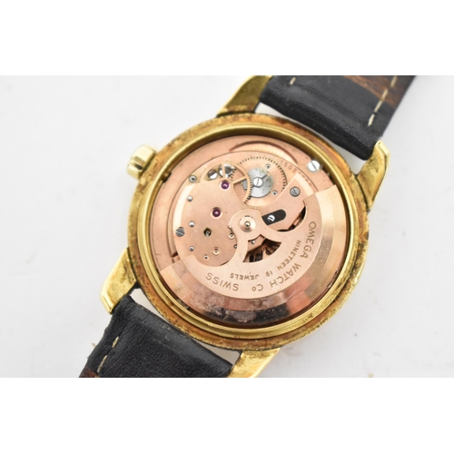 63 - An Omega Seamaster, automatic, gents, 18ct gold wristwatch, having a gilt dial, centre seconds, bato... 