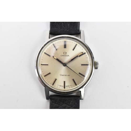 64 - An Omega, manual wind, gents, stainless steel wristwatch, having a silvered dial, centre seconds, an... 