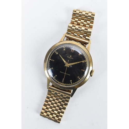 71 - A Rolex, manual wind, gents, 9ct gold wristwatch, circa 1937, having a black dial, centre seconds, g... 