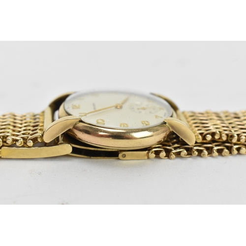 72 - A Longines, manual wind, gents, 9ct gold wristwatch, circa 1950s, having a silvered dial, subsidiary... 