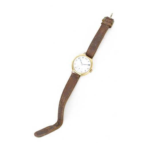 73 - A 1920s, manual wind, gents, 18ct gold wristwatch, having a white enamel dial, subsidiary seconds di... 