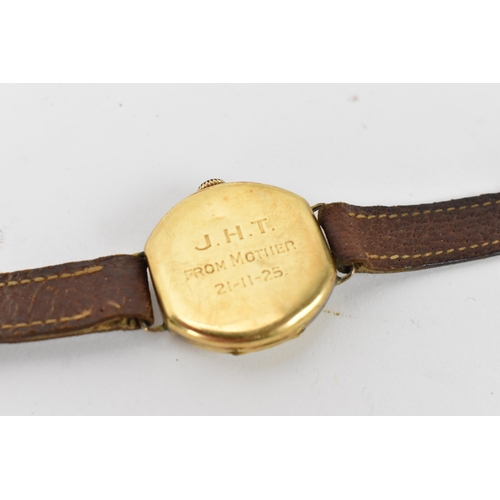 73 - A 1920s, manual wind, gents, 18ct gold wristwatch, having a white enamel dial, subsidiary seconds di... 