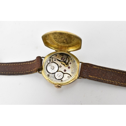 73 - A 1920s, manual wind, gents, 18ct gold wristwatch, having a white enamel dial, subsidiary seconds di... 