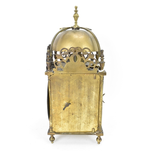 76 - A circa 1900 Mappin & Webb lantern clock, in the 17th century style, the brass case having a turned ... 