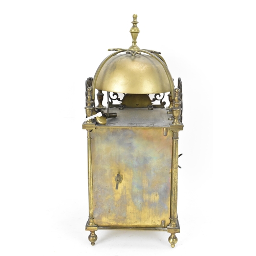 76 - A circa 1900 Mappin & Webb lantern clock, in the 17th century style, the brass case having a turned ... 