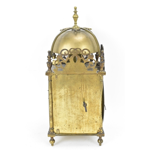 76 - A circa 1900 Mappin & Webb lantern clock, in the 17th century style, the brass case having a turned ... 