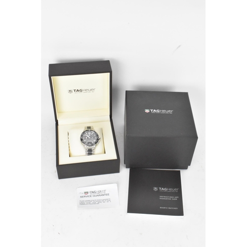 80 - A Tag Heuer Formula 1, quartz, alarm, gents, stainless steel wristwatch, having a black dial, two su... 