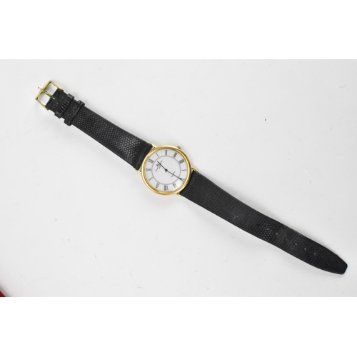 84 - A Baume & Mercier, quartz, gents, 18ct gold wristwatch, having a white dial with black Roman numeral... 