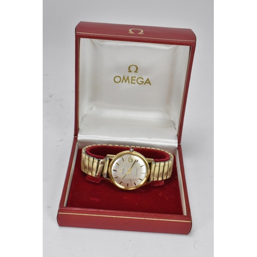 85 - An Omega Seamaster, automatic, gents, gold plated wristwatch, having a silvered dial, centre seconds... 