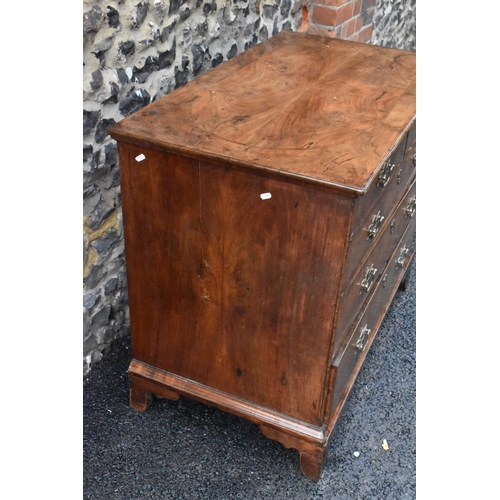 152 - A circa 1700 walnut chest of drawers, having a quarter cut veneered and cross banded top, two short ... 