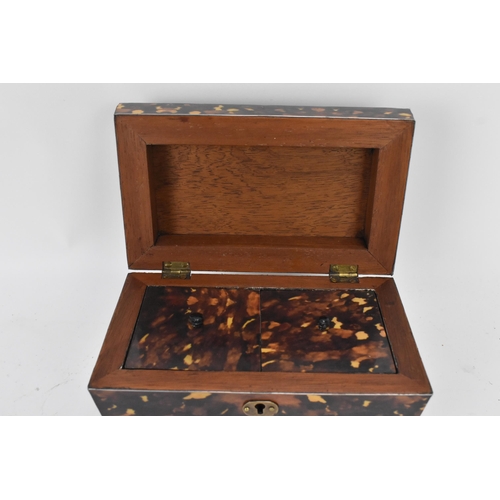 159 - A late 20th century printed tortoiseshell pattern, twin compartment tea caddy, of sarcophagus form, ... 